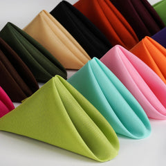 Poly Premier napkins folded into triangles in various colors